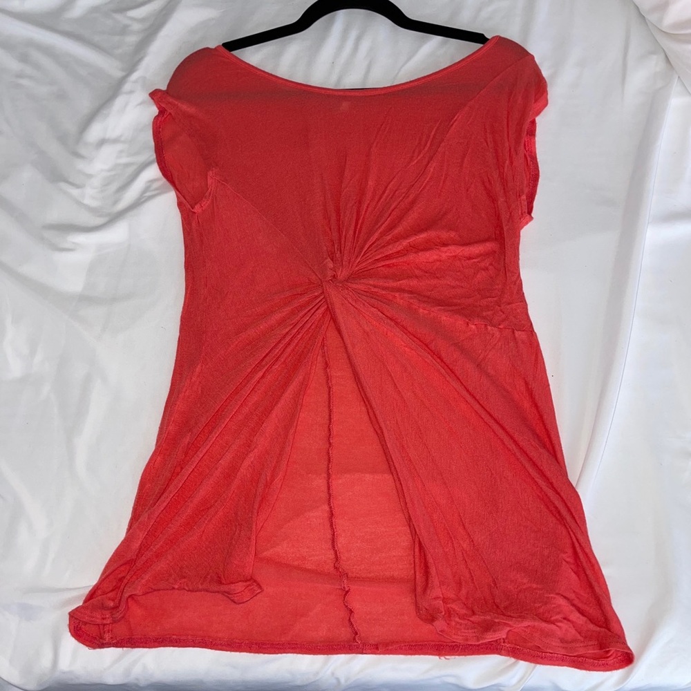 Orange blouse with twisted knot and slit